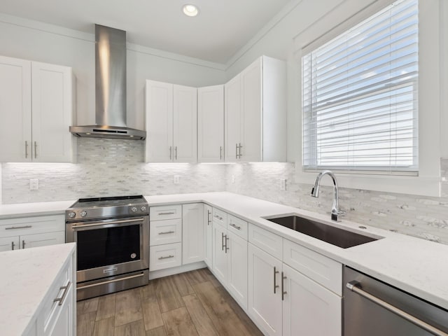 14 Bayshore Pines Ct, Miramar Beach, FL 32550 - kitchen featuring wall chimney range hood, appliances with stainless steel finishes, a sink, backsplash, and recessed lighting