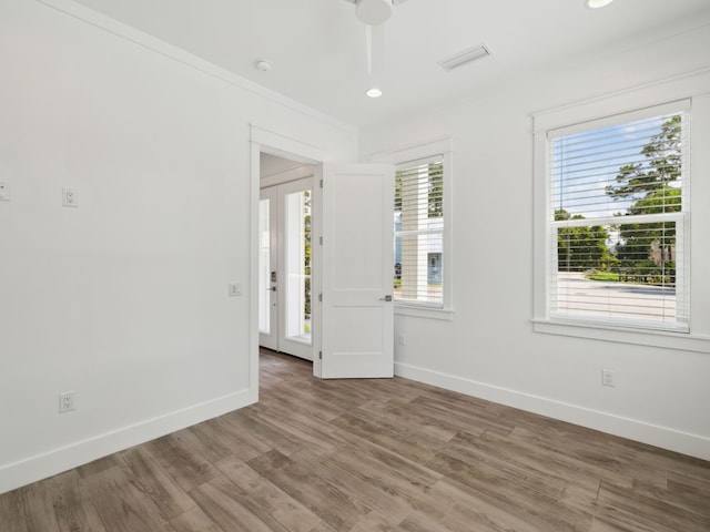 14 Bayshore Pines Ct, Miramar Beach, FL 32550 - unfurnished room with baseboards, wood finished floors, a smoke detector, and recessed lighting