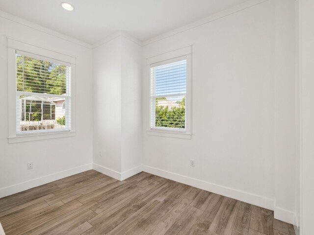 14 Bayshore Pines Ct, Miramar Beach, FL 32550 - unfurnished room featuring light wood finished floors, baseboards, crown molding, and recessed lighting