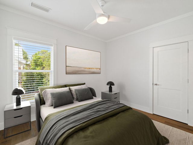 14 Bayshore Pines Ct, Miramar Beach, FL 32550 - bedroom featuring crown molding, wood finished floors, ceiling fan, and baseboards