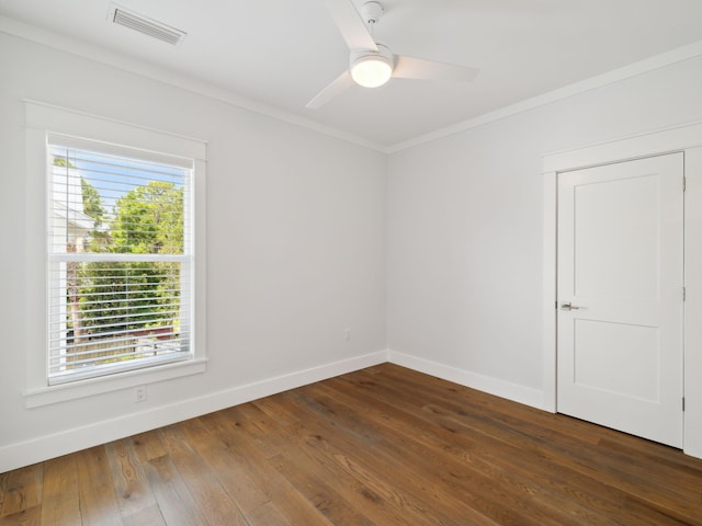 14 Bayshore Pines Ct, Miramar Beach, FL 32550 - empty room with crown molding, baseboards, dark wood-style floors, and a ceiling fan