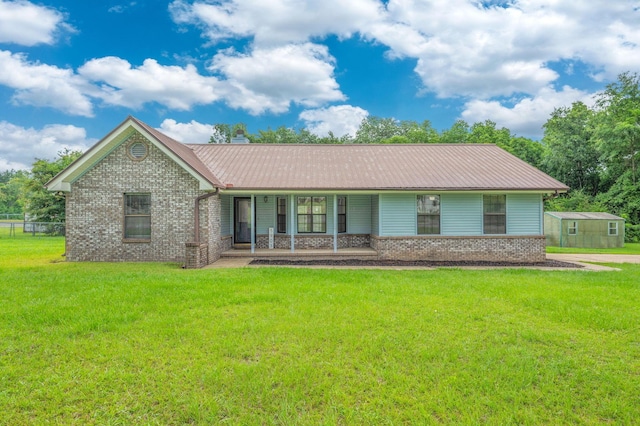 5903 Jack Stokes Rd, Baker, FL 32531 - view of front facade featuring a front lawn, brick siding, and a metal roof