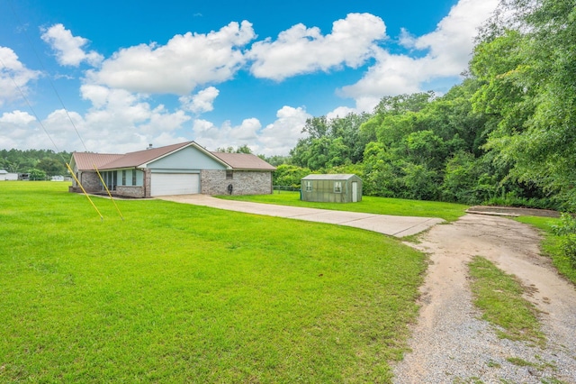 5903 Jack Stokes Rd, Baker, FL 32531 - ranch-style home featuring driveway, a storage unit, a front lawn, and an attached garage