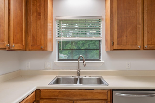 5903 Jack Stokes Rd, Baker, FL 32531 - kitchen featuring dishwasher, light countertops, and brown cabinetry