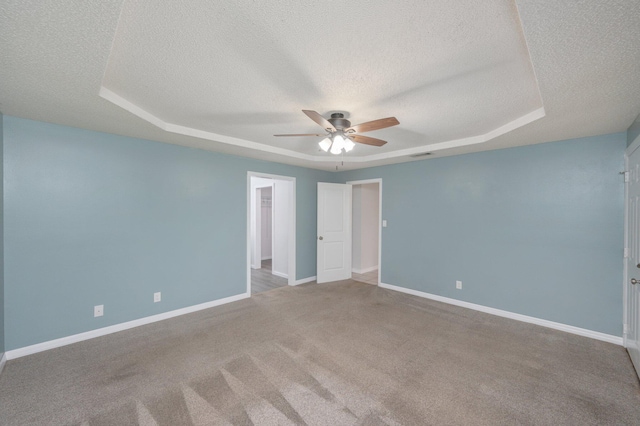 5903 Jack Stokes Rd, Baker, FL 32531 - carpeted empty room with a textured ceiling, a raised ceiling, and ceiling fan