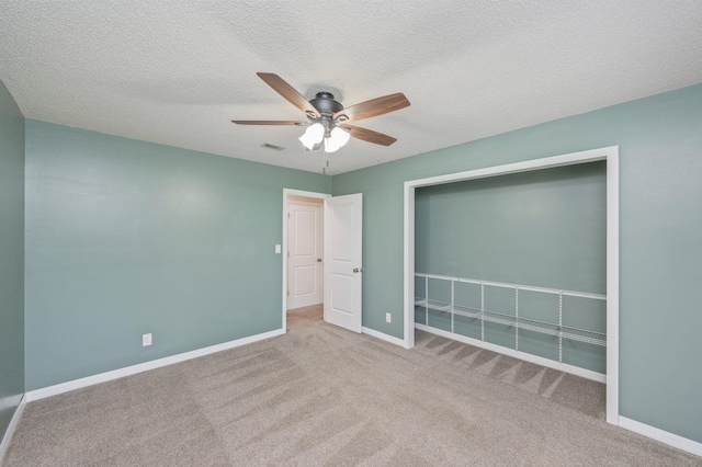 5903 Jack Stokes Rd, Baker, FL 32531 - unfurnished bedroom with carpet, a ceiling fan, a closet, and a textured ceiling