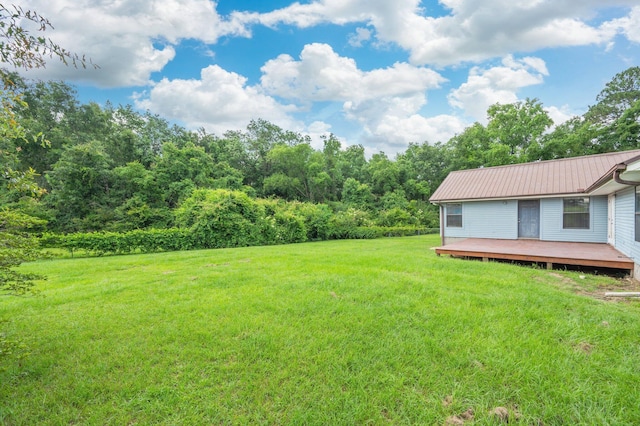 5903 Jack Stokes Rd, Baker, FL 32531 - view of green lawn with a deck