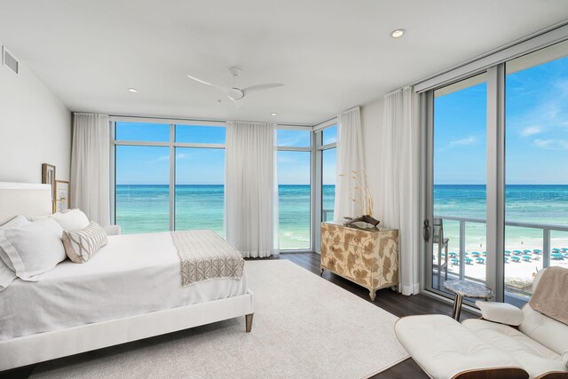 3820 E County Highway 30a Unit 408, Santa Rosa Beach, FL 32459 - bedroom featuring expansive windows, view of water and beach, multiple windows, dark wood finished floors, and recessed lighting