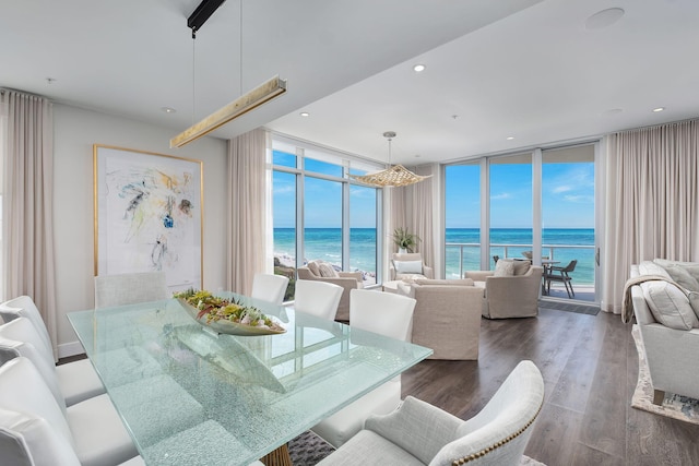 3820 E County Highway 30a Unit 408, Santa Rosa Beach, FL 32459 - dining area with floor to ceiling windows, a water view, wood finished floors, a chandelier, and recessed lighting
