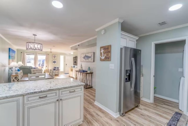 2800 Scenic Gulf Dr Unit 32, Miramar Beach, FL 32550 - kitchen with stainless steel refrigerator with ice dispenser, light wood-style floors, light stone counters, open floor plan, and white cabinets