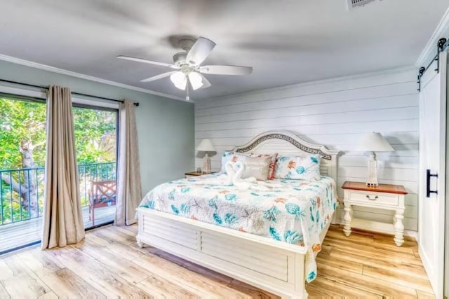 2800 Scenic Gulf Dr Unit 32, Miramar Beach, FL 32550 - bedroom featuring a barn door, access to exterior, wood finished floors, ornamental molding, and a ceiling fan