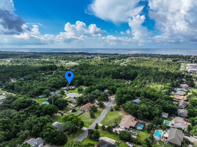3995 Spanish Moss Cv, Gulf Breeze, FL 32563 - drone / aerial view of a heavily wooded area and a nearby body of water