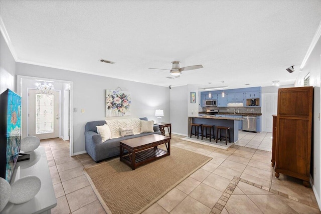 3995 Spanish Moss Cv, Gulf Breeze, FL 32563 - living area with light tile patterned floors, a textured ceiling, and ceiling fan