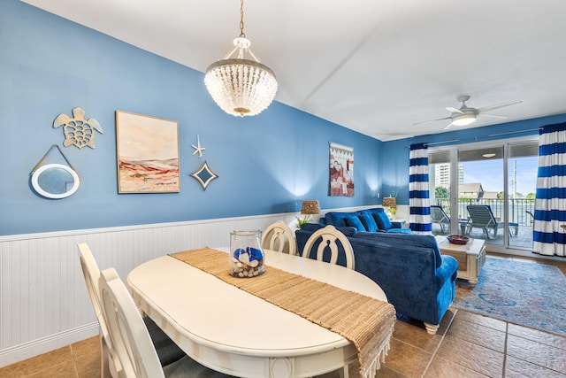 122 Seascape Dr Unit 208, Miramar Beach, FL 32550 - dining room featuring a wainscoted wall and ceiling fan