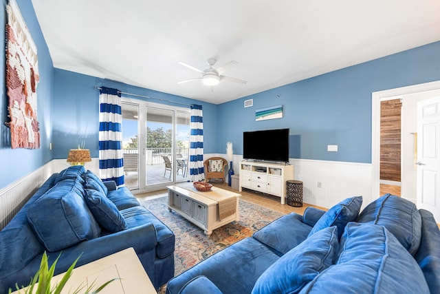 122 Seascape Dr Unit 208, Miramar Beach, FL 32550 - living area featuring wainscoting, a ceiling fan, and wood finished floors