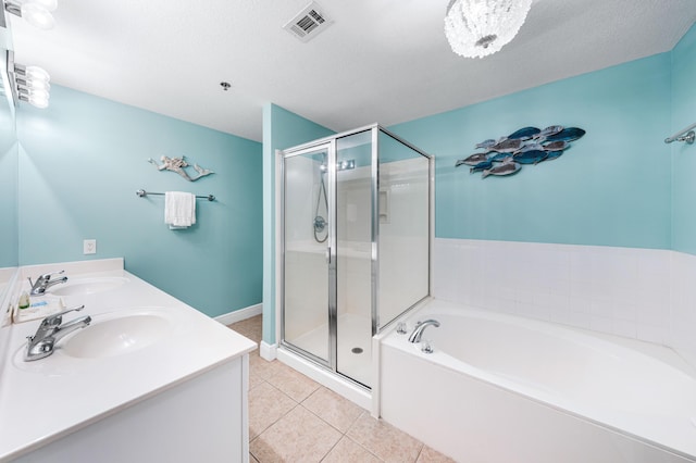 122 Seascape Dr Unit 208, Miramar Beach, FL 32550 - full bathroom with a garden tub, a stall shower, tile patterned flooring, and double vanity