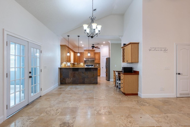 2007 Bayshore Dr, Niceville, FL 32578 - kitchen with freestanding refrigerator, a peninsula, high vaulted ceiling, under cabinet range hood, and a chandelier