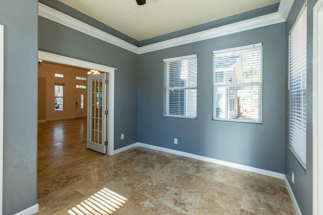 2007 Bayshore Dr, Niceville, FL 32578 - spare room featuring crown molding and stone finish floors
