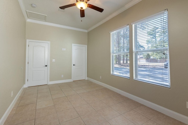2007 Bayshore Dr, Niceville, FL 32578 - spare room with ornamental molding, light tile patterned floors, ceiling fan, and attic access