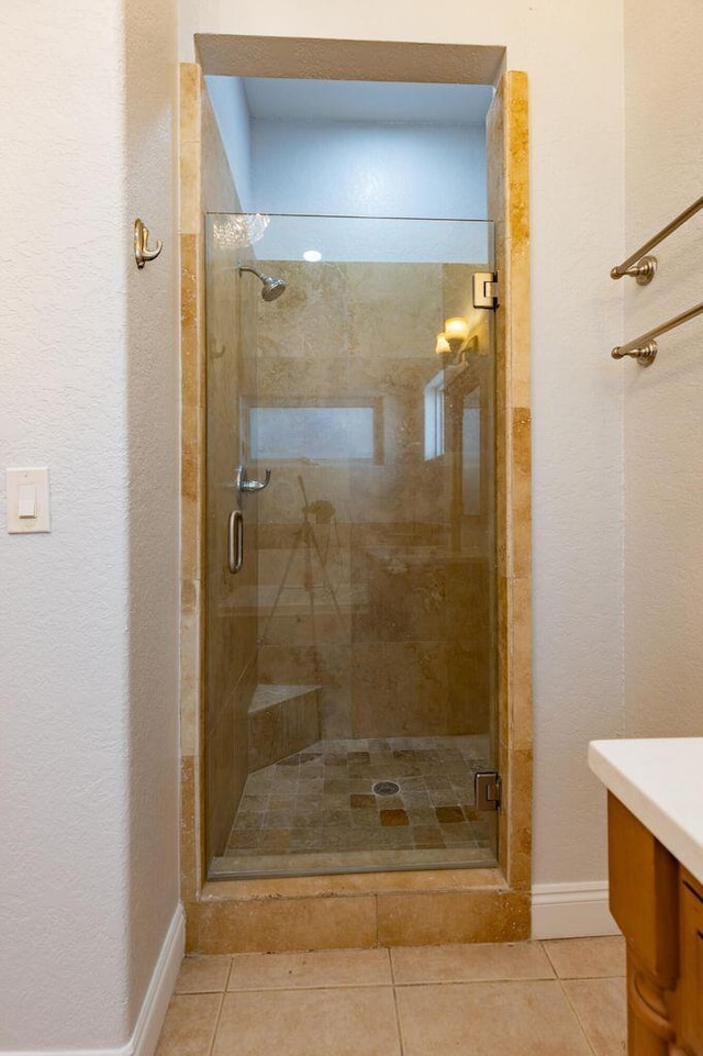 2007 Bayshore Dr, Niceville, FL 32578 - bathroom with vanity, a stall shower, tile patterned floors, and a textured wall