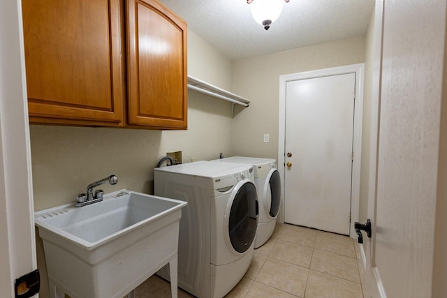 2007 Bayshore Dr, Niceville, FL 32578 - laundry room with cabinet space, separate washer and dryer, and light tile patterned floors