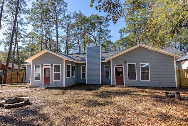2007 Bayshore Dr, Niceville, FL 32578 - ranch-style home featuring a chimney, an outdoor fire pit, and roof with shingles