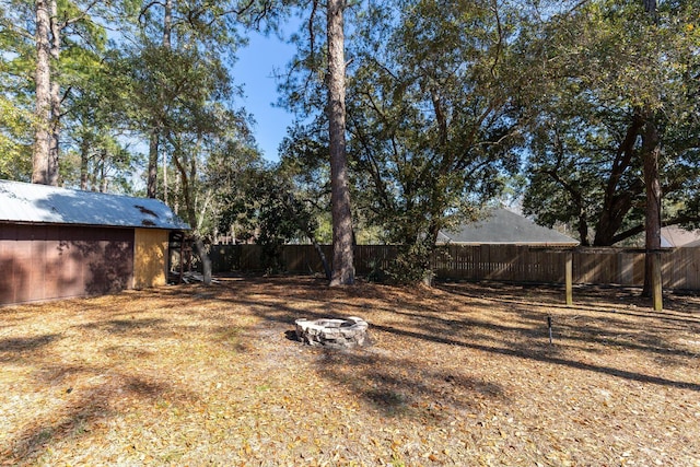 2007 Bayshore Dr, Niceville, FL 32578 - fenced backyard featuring an outdoor fire pit