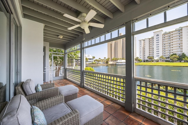 9815 US Highway 98 Unit 34, Miramar Beach, FL 32550 - sunroom featuring a water view, plenty of natural light, a ceiling fan, and beamed ceiling