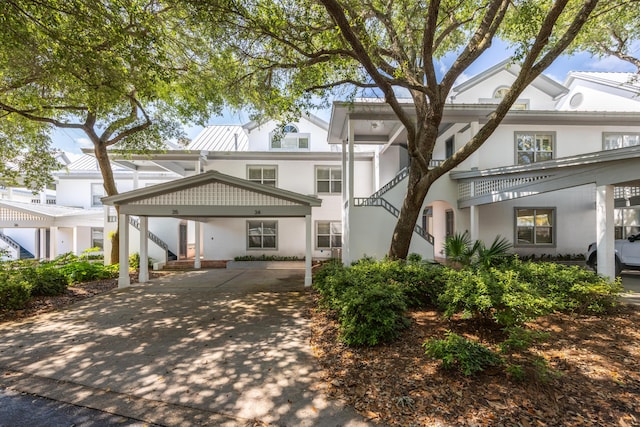 9815 US Highway 98 Unit 34, Miramar Beach, FL 32550 - view of front facade with stucco siding and concrete driveway