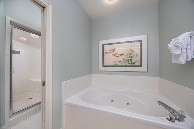 9815 US Highway 98 Unit 34, Miramar Beach, FL 32550 - full bathroom with a jetted tub, a stall shower, and tile patterned floors