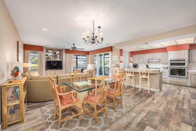 9815 US Highway 98 Unit 34, Miramar Beach, FL 32550 - dining space with a chandelier, light wood finished floors, ceiling fan, and recessed lighting