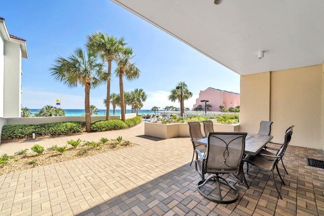 550 Tops L Beach Blvd # 102, Miramar Beach, FL 32550 - view of patio featuring outdoor dining space and a water view