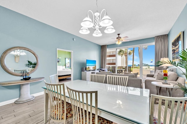 550 Tops L Beach Blvd # 102, Miramar Beach, FL 32550 - dining space featuring a chandelier, wood finished floors, baseboards, and ceiling fan