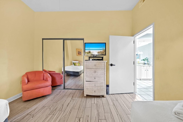 550 Tops L Beach Blvd # 102, Miramar Beach, FL 32550 - bedroom with light wood-type flooring, a closet, and baseboards