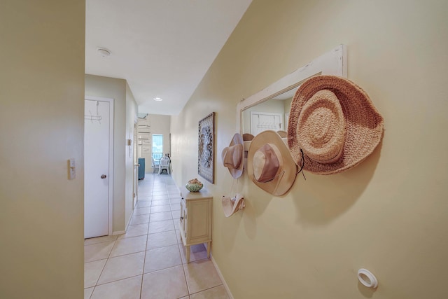 17614 Front Bch Unit E17, Panama City Beach, FL 32413 - corridor with light tile patterned flooring and baseboards