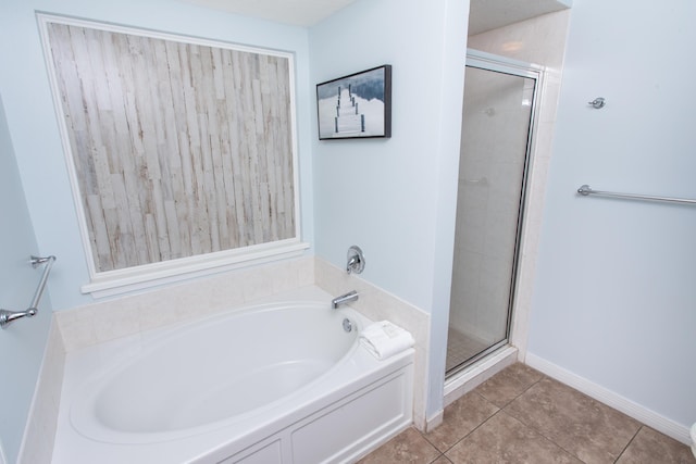 1517 Miracle Strip Pkwy Unit 403, Fort Walton Beach, FL 32548 - full bathroom featuring a garden tub, a stall shower, and tile patterned floors