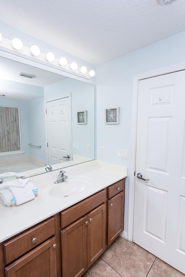1517 Miracle Strip Pkwy Unit 403, Fort Walton Beach, FL 32548 - bathroom featuring vanity and tile patterned flooring