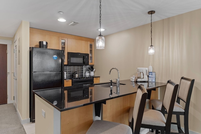 9700 Grand Sandestin Blvd Unit 4313, Miramar Beach, FL 32550 - kitchen with black appliances, a sink, dark countertops, glass insert cabinets, and decorative backsplash