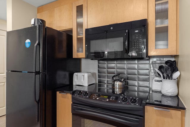 9700 Grand Sandestin Blvd Unit 4313, Miramar Beach, FL 32550 - kitchen featuring black appliances, decorative backsplash, dark countertops, and glass insert cabinets