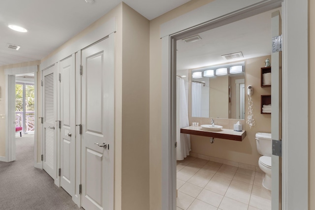 9700 Grand Sandestin Blvd Unit 4313, Miramar Beach, FL 32550 - full bathroom featuring a sink, toilet, a closet, and baseboards