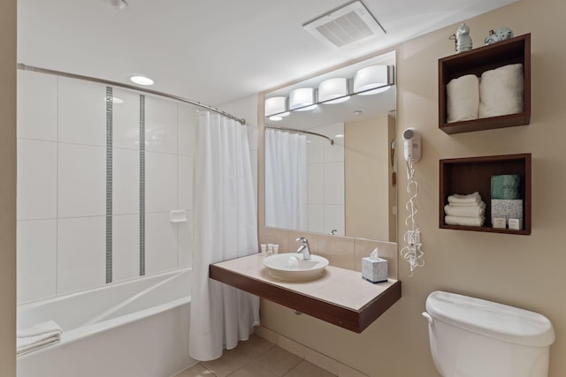 9700 Grand Sandestin Blvd Unit 4313, Miramar Beach, FL 32550 - bathroom with toilet, tile patterned flooring, shower / bath combo with shower curtain, a sink, and tasteful backsplash