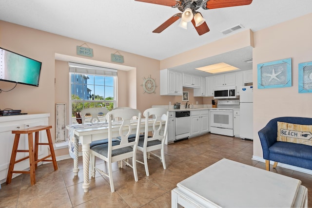 2384 Scenic Gulf Dr Unit 112, Miramar Beach, FL 32550 - dining space with ceiling fan, light tile patterned floors, and baseboards