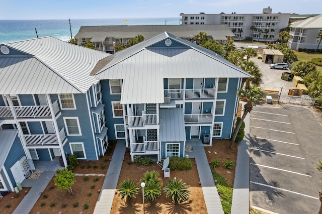 2384 Scenic Gulf Dr Unit 112, Miramar Beach, FL 32550 - view of apartment building / complex with a water view and uncovered parking