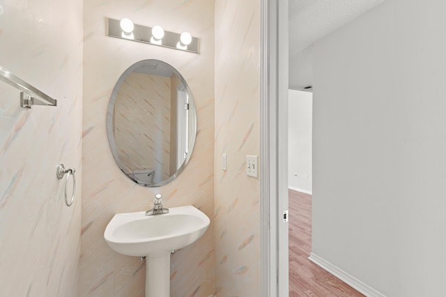 7 Citation Dr, Shalimar, FL 32579 - bathroom featuring wood finished floors and baseboards
