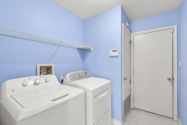 7 Citation Dr, Shalimar, FL 32579 - washroom with independent washer and dryer and a textured ceiling