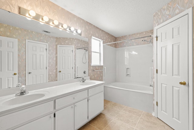 7 Citation Dr, Shalimar, FL 32579 - full bath featuring tub / shower combination, wallpapered walls, a textured ceiling, double vanity, and tile patterned floors