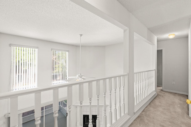 7 Citation Dr, Shalimar, FL 32579 - hallway with carpet and a textured ceiling