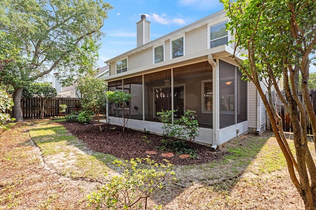 7 Citation Dr, Shalimar, FL 32579 - back of property with a sunroom and a chimney