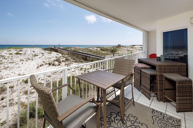 376 Santa Rosa Blvd Unit 101, Fort Walton Beach, FL 32548 - balcony featuring view of water and beach and outdoor dining area