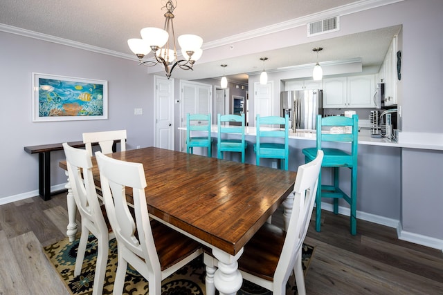 376 Santa Rosa Blvd Unit 101, Fort Walton Beach, FL 32548 - dining area with dark wood finished floors, a chandelier, ornamental molding, and baseboards